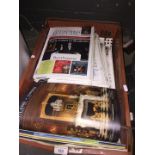A box of Antiques Trade Gazette magazines.
