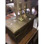 A brass bound wood box and a pair of brass candlesticks