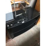 A black glass tv stand