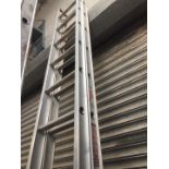 A pair of extending aluminium ladders