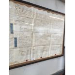 A framed early 18th century indenture.