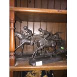 Three metal figures - jockeys on horses ( two of them have broken hands )