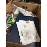 A box of stamp albums and first day covers