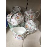 A 21 piece Minton Haddon Hall tea set.