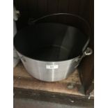 An aluminium jam pan