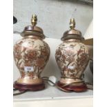 Pair of pottery table lamps with shades