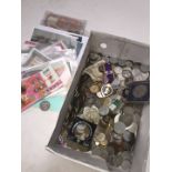 A box of world coins, banknotes and medals