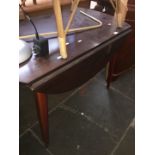 A drop leaf table and 4 chairs