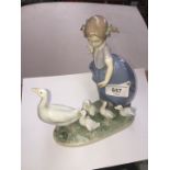 A Lladro figure of a girl with geese