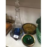 Glass decanter and three pieces of coloured glass