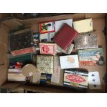 A box of vintage playing cards and crayons etc