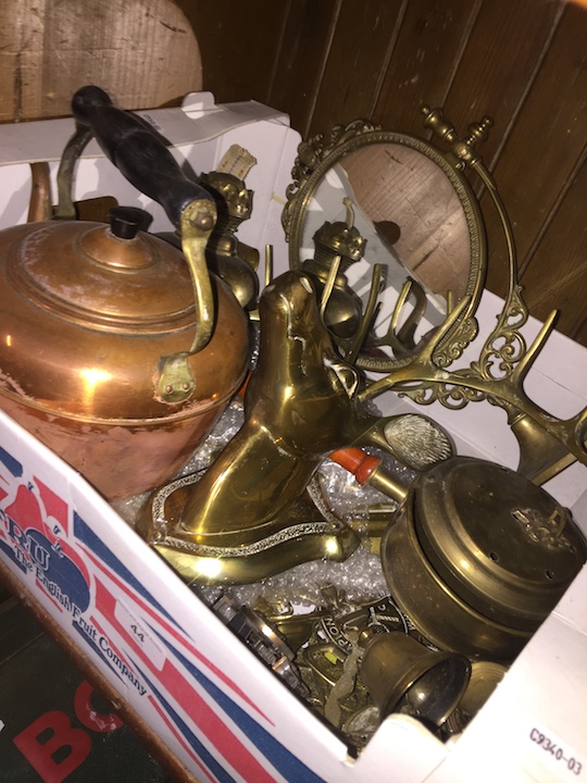 A box of brass and copperware to include lamp, teapot, deer, mirror, etc.