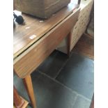 A vintage 1960s formica top drop leaf table