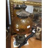 A reproduction table lamp with bulbous glass shade