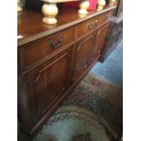 A yew wood sideboard