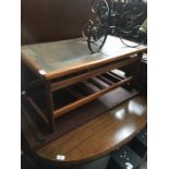 A teak and tile top coffee table
