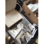 A box of postcards and military photographs