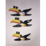 A set of three reproduction graduated Guinness Toucan wall plaques