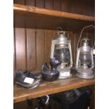 A pair of paraffin lamps, a vintage silver plated money box in shape of a duck marked Falstaff and a