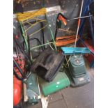 A quantity of lawnmowers, lawn spreader and a lawn spiker