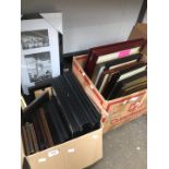 Two boxes of pictures and frames including scenes of Wigan.