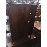 An oak record cabinet