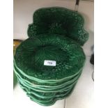 Nine Victorian green moulded plates