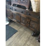 An oak priory style sideboard