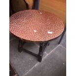 A copper top round table