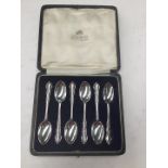 Six boxed silver spoons