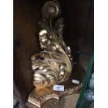 A gilt composite wall sconce