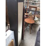 A tall narrow metal storage cupboard