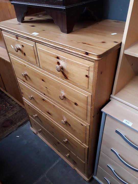 A pine chest of drawers