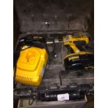 A DeWalt 18V cordless drill with battery and charger in original case.