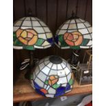 A pair of Tiffany style lamps and a similar shade.