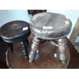 Two old small milking stools