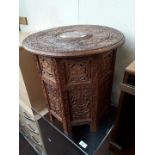 A carved folding Indian style table