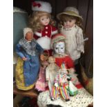 A collection of dolls to include bisque.