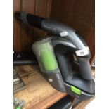 A Gtech 22V multi cordless handheld vacuum cleaner with tools.