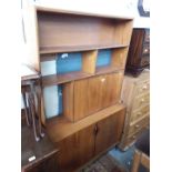 An S Form teak room divider bookcase on hairpin legs.