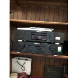 A Marantz CD player CD6004 and a Marantz integrated amplifier PM6004 both with remotes and