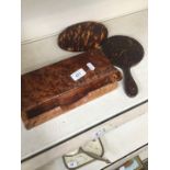 A burr wood pen tray and a pair of imitation tortoiseshell mirrors