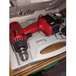 A Power Devil cordless drill with battery and charger in original case.