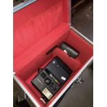An aluminium camera case containing a 1980s Kodak Colorburst 250 instant camera and a Kodak
