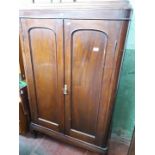 A mahogany small two drawer wardrobe