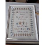 A framed needlework picture