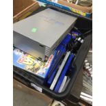 A box containing a PS2 console, controller and quantity of games.