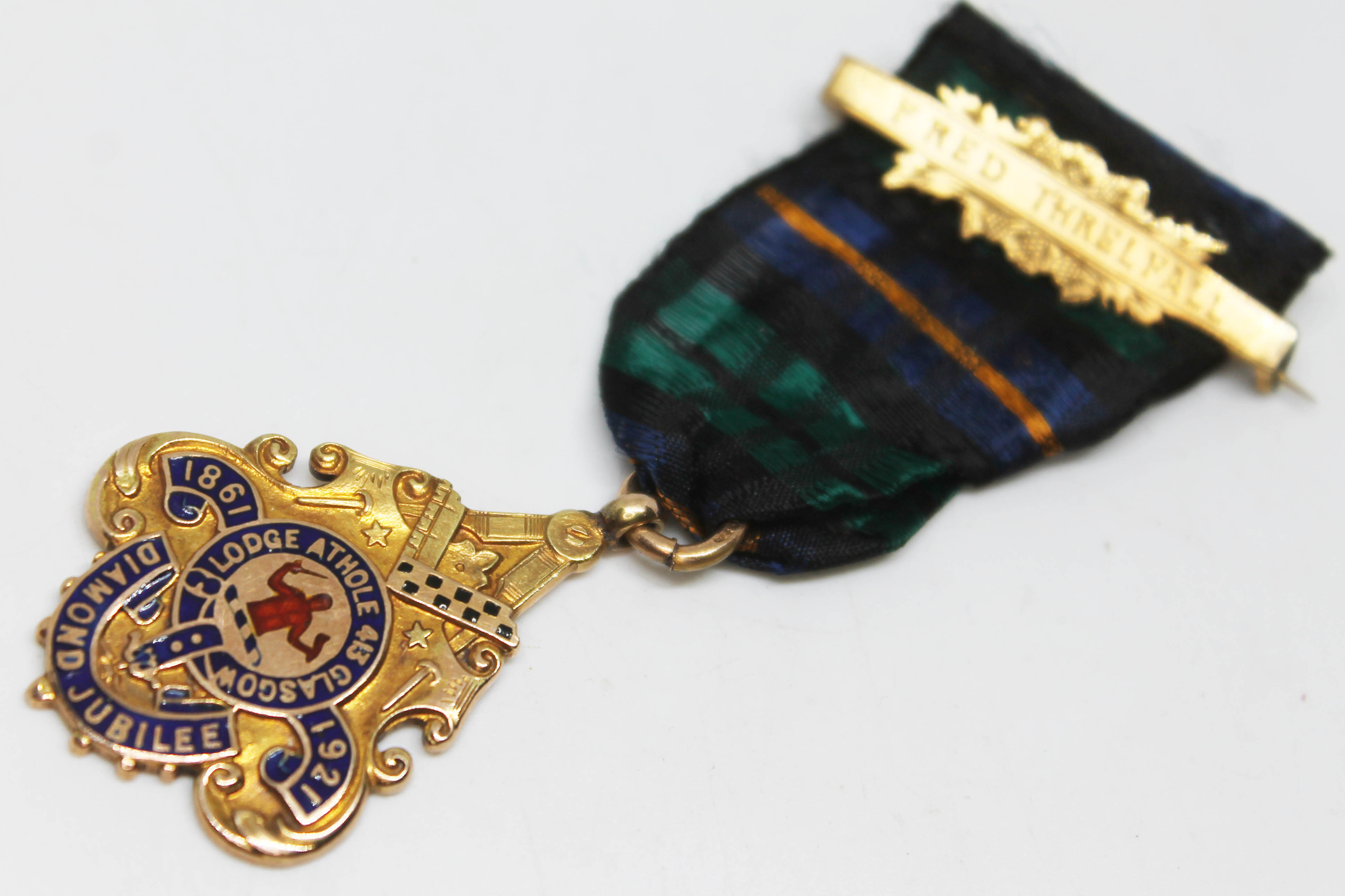 A hallmarked 9ct gold and enamel Masonic medal inscribed Athole 413 Lodge Glasgow 1861 1921