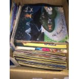 A box of 45s - picture sleeves and discs