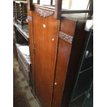 A 1930s oak wardrobe.